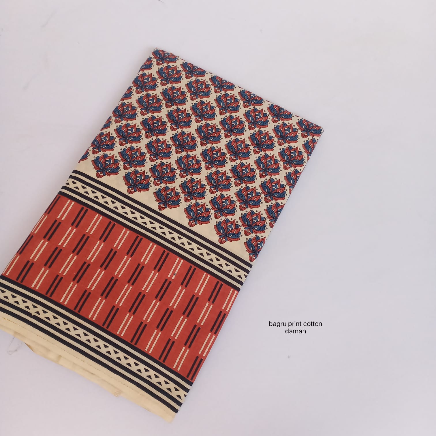 Bagru handblock cotton fabric with traditional daman border floral design, artisan-crafted wholesale by Fabtexs